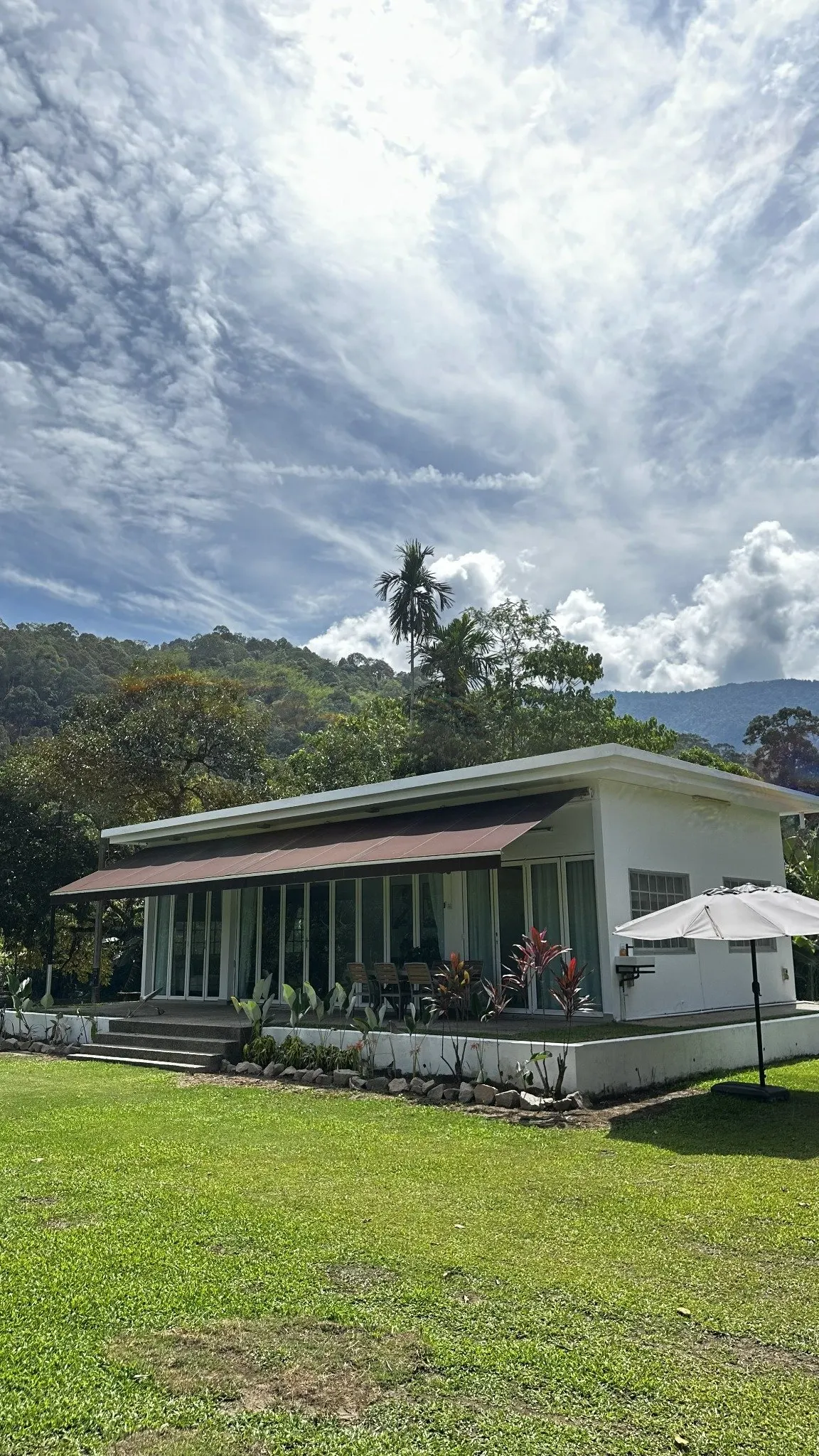 Tanalui exterior on an open lawn